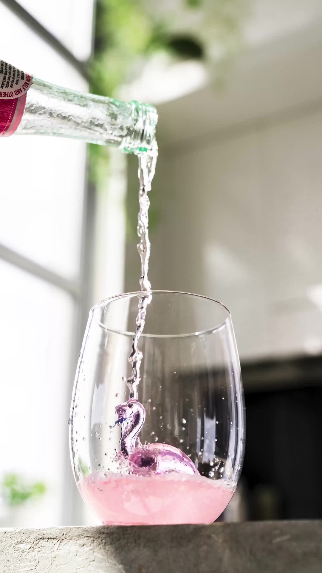 Instagram post with the caption: 'Who else loves to swim in wine?! These flamingos do🍷🤣...'